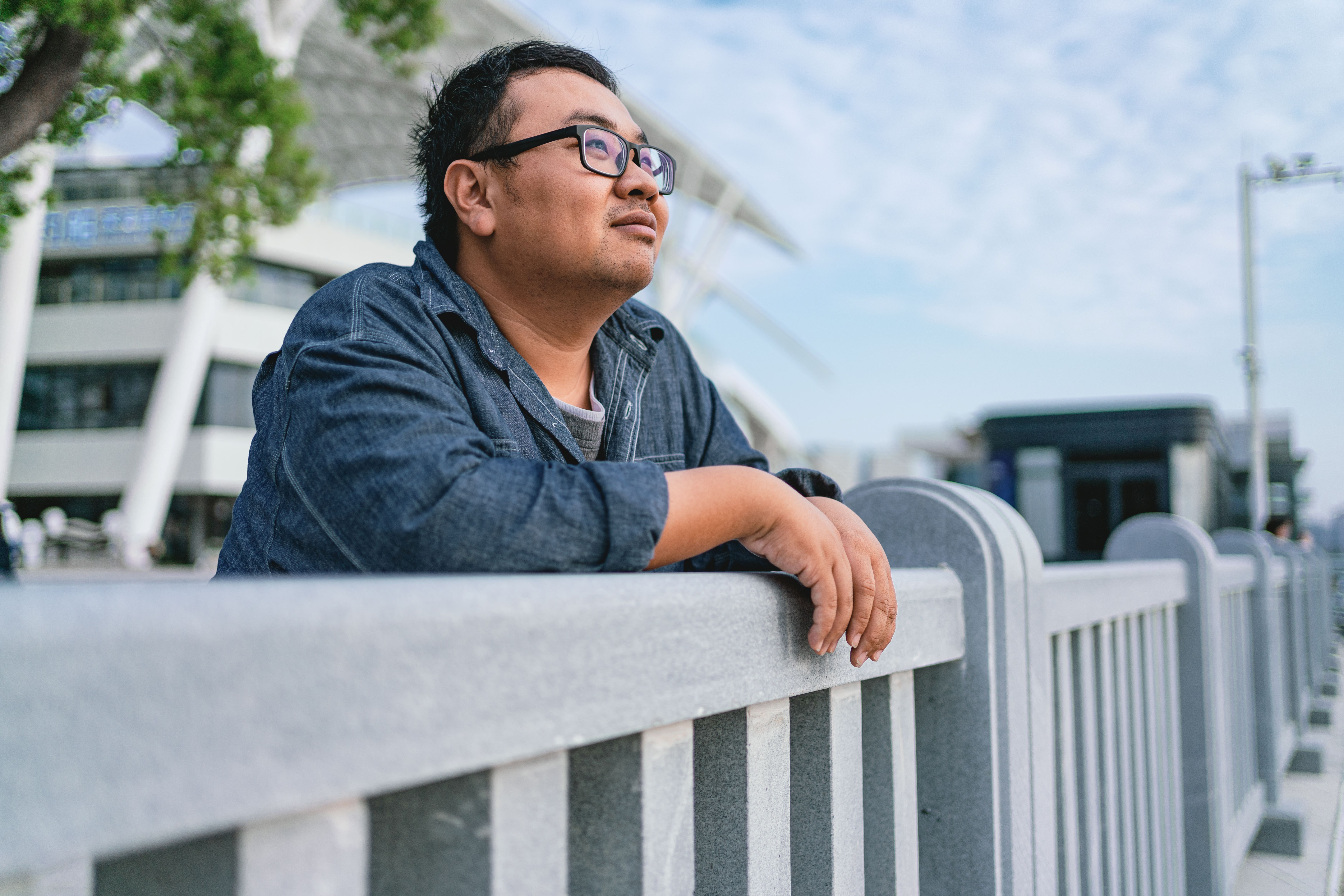 A man standing outside looking at the view – Pfizer Clinical Trials