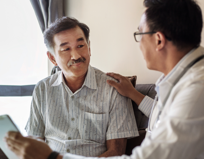Clinical trial participant speaking with doctor