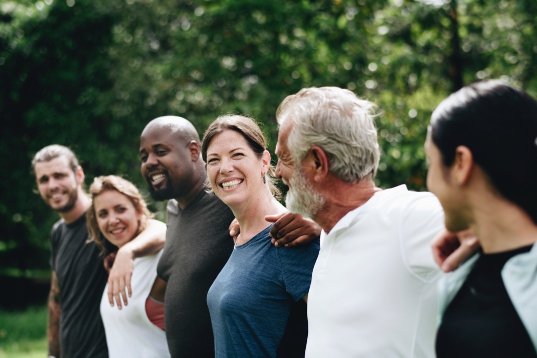 Happy diverse people together in the park – Pfizer Clinical Trials