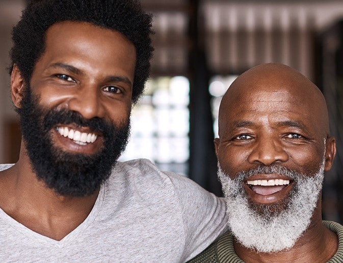 Father and son smiling | Pfizer clinical trials