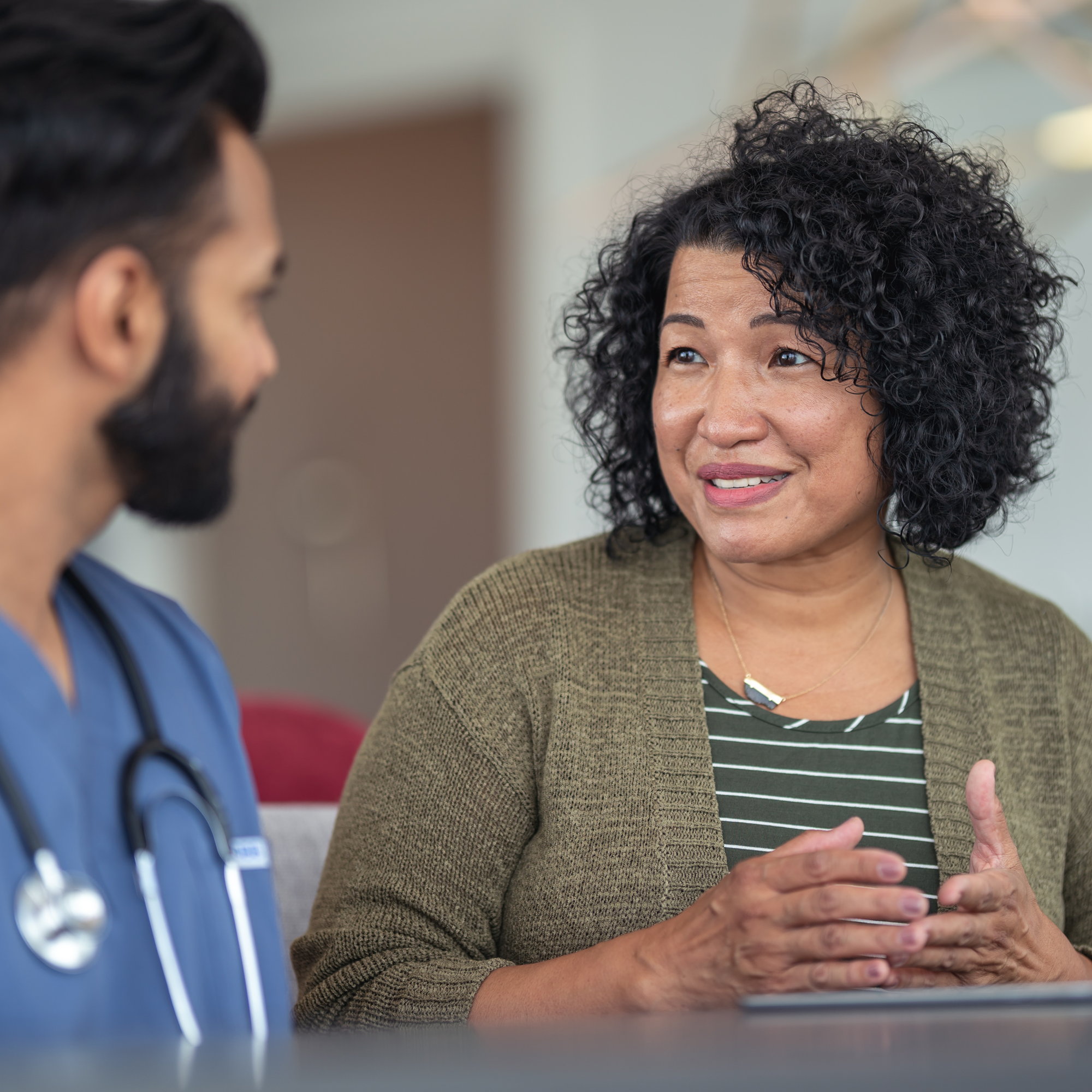 Patient and doctor consulting in hospital | Pfizer clinical trials