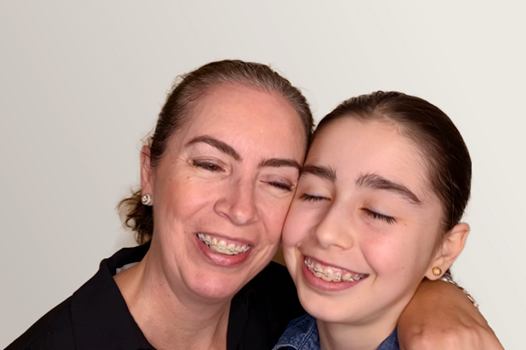 Mother and daughter hugging