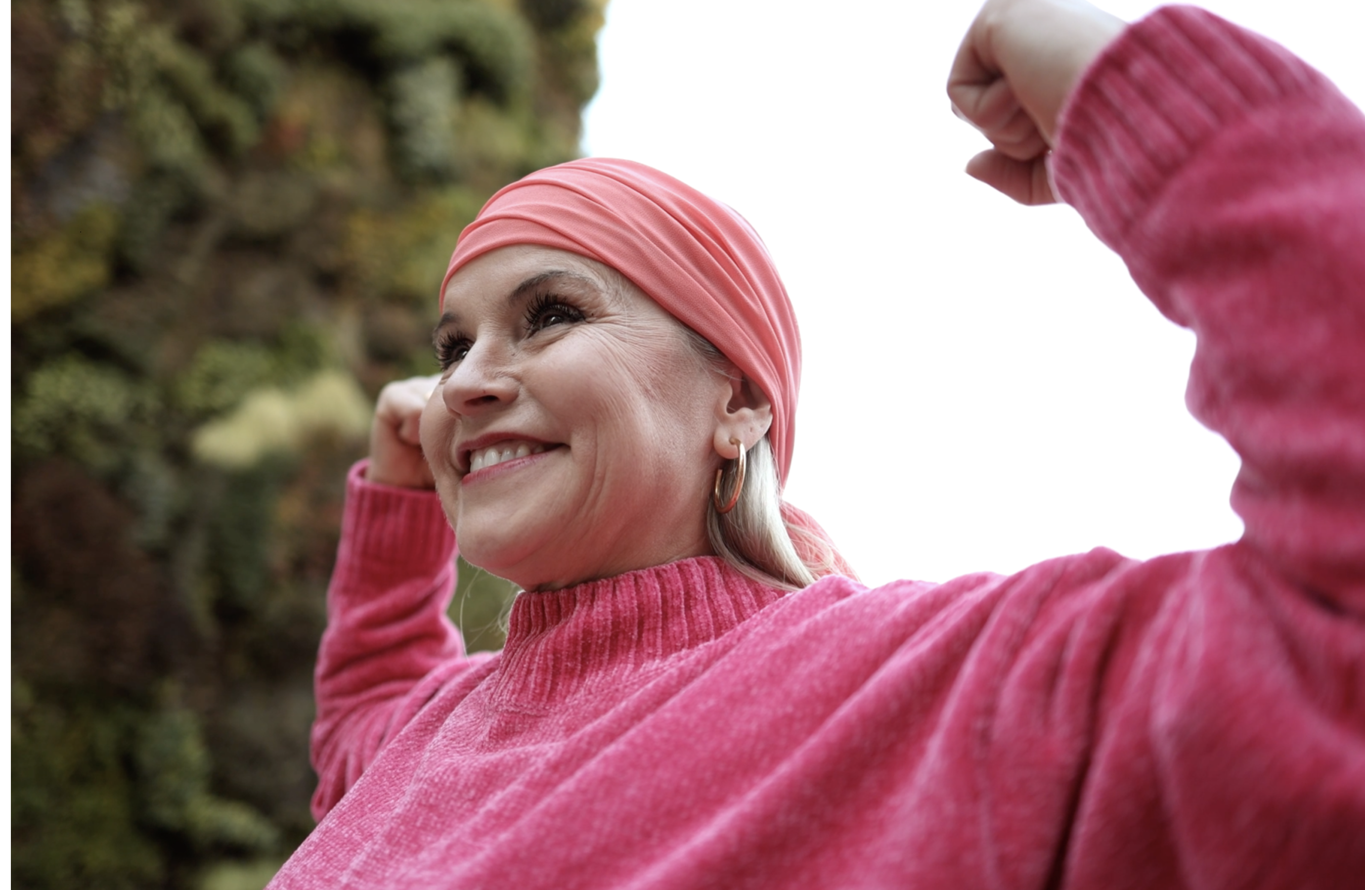Woman flexing her muscles | Pfizer clinical trials