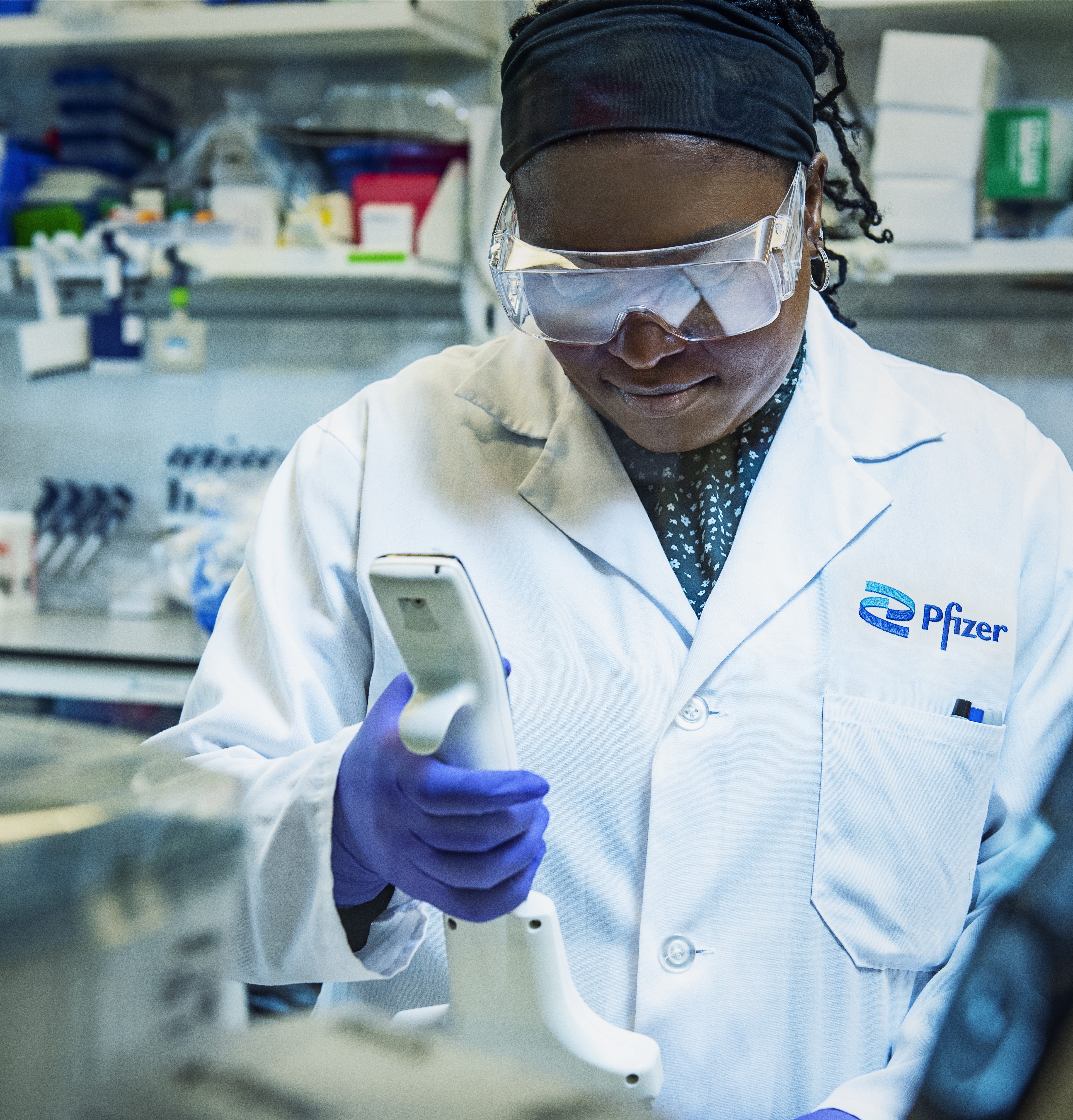 Female scientist looking at measurements