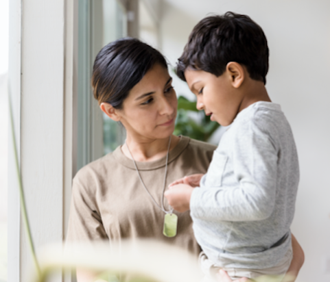 Mother holding child rare disease clinical trial participant