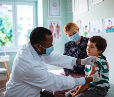 Healthcare provider giving pediatric patient a shot