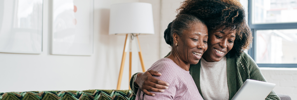 Clinical trial participant and daughter embracing