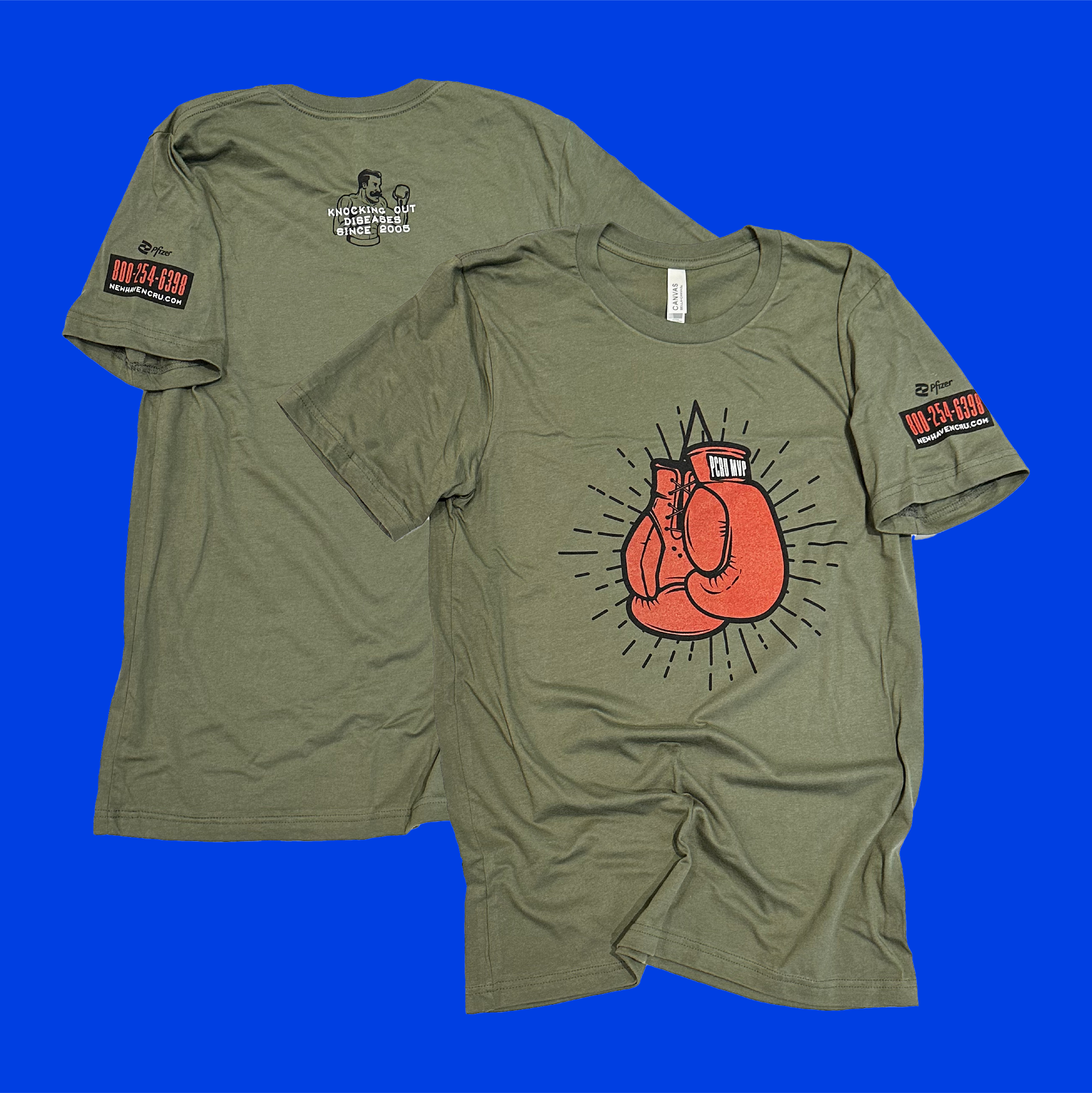  A medium green t-shirt on a bold blue background with an image of boxing gloves that say "PCRU MVP" printed on the front and writing on the back and sleeve.