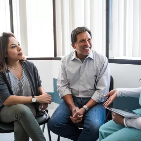 Couple in clinic hearing information