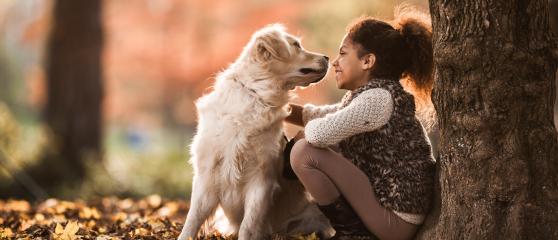 Girl with dog outdoors