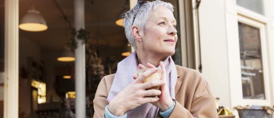Woman at coffee shop enjoying a drink