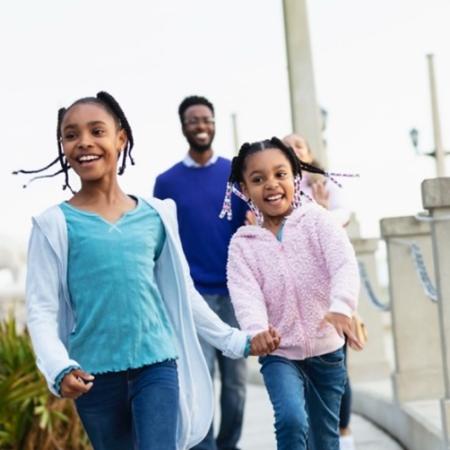 Young family walking outside– Pfizer Clinical Trials
