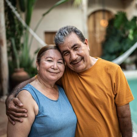Happy couple outside embracing | Pfizer clinical trials