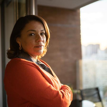 Portrait of a woman in front of a window – Pfizer Clinical Trials