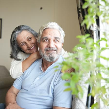 Mature couple looking out the window – Pfizer Clinical Trials